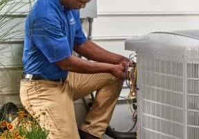 hvac-tech-installing-carrier-air-conditioner-lehigh acres